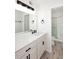 Bright bathroom offers a walk-in shower and modern vanity with a large mirror at 4902 E Charter Oak Rd, Scottsdale, AZ 85254