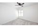 Bedroom featuring a neutral carpet, white walls, and a window providing natural light into the room at 4902 E Charter Oak Rd, Scottsdale, AZ 85254