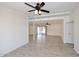 Spacious open-concept living room with tile floors and a ceiling fan at 4902 E Charter Oak Rd, Scottsdale, AZ 85254