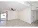 Spacious open-concept living room with tile floors and a ceiling fan at 4902 E Charter Oak Rd, Scottsdale, AZ 85254