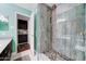 A bathroom showing a tiled shower with decorative stones, and entry to the vanity at 5122 E Shea Blvd # 1020, Scottsdale, AZ 85254