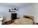 Bedroom with hardwood floors, and small decorative shelves, alongside a dresser at 5122 E Shea Blvd # 1020, Scottsdale, AZ 85254