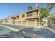 Well-maintained condo complex showcasing garages and mature shade trees at 5122 E Shea Blvd # 1020, Scottsdale, AZ 85254