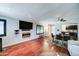 Spacious living area showcasing hardwood floors, an electric fireplace, and stylish furnishings at 5122 E Shea Blvd # 1020, Scottsdale, AZ 85254