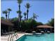 Resort-style community pool with water features, lounge seating, and tropical landscaping at 5122 E Shea Blvd # 1020, Scottsdale, AZ 85254