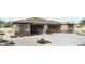 Charming single-story home with a neutral color scheme, attached two-car garage, and low maintenance desert landscaping at 5633 N 205Th Ln, Buckeye, AZ 85396