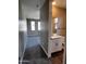 Hallway view leading to bedroom and bathroom, featuring neutral colors and modern fixtures at 5633 N 205Th Ln, Buckeye, AZ 85396