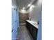 Modern bathroom featuring double sinks and a tiled shower at 5641 N 205Th Ln, Buckeye, AZ 85396