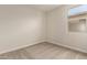 Bedroom featuring neutral colors, carpet, and a bright window at 5641 N 205Th Ln, Buckeye, AZ 85396