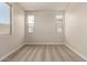 Spacious bedroom with carpet, offering lots of light from the windows at 5641 N 205Th Ln, Buckeye, AZ 85396