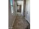 Hallway with recessed lights, windows, and white doors at 5641 N 205Th Ln, Buckeye, AZ 85396