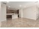 Spacious open-concept kitchen with brown cabinets, a large island, and modern appliances at 5641 N 205Th Ln, Buckeye, AZ 85396