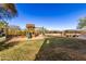 Spacious backyard with playground, swing set, and lush lawn, perfect for Gathering activities at 6506 W Bent Tree Dr, Phoenix, AZ 85083