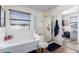 Bathroom with soaking tub, glass-enclosed shower, and window with views of the neighborhood at 6506 W Bent Tree Dr, Phoenix, AZ 85083