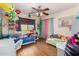 Charming ' bedroom with colorful curtains, stuffed animal decor, and lots of natural light at 6506 W Bent Tree Dr, Phoenix, AZ 85083