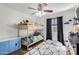 Comfortable ' room featuring a bunk bed, ceiling fan, and neutral walls perfect for personalization at 6506 W Bent Tree Dr, Phoenix, AZ 85083