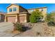 Two story home featuring an attached two car garage, landscaped yard and walkway leading to the front door at 6506 W Bent Tree Dr, Phoenix, AZ 85083