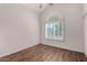 This bedroom features hardwood floors, plantation shutters and tons of bright, natural light at 6520 E Sugarloaf St, Mesa, AZ 85215