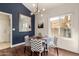 Cozy dining area featuring modern lighting, a round table, and stylish chevron-patterned chairs at 6520 E Sugarloaf St, Mesa, AZ 85215