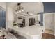 Spacious open kitchen with a breakfast bar, stainless steel appliances, and modern lighting at 6520 E Sugarloaf St, Mesa, AZ 85215