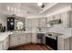 Bright kitchen with stainless steel appliances, white countertops, and a modern backsplash at 6520 E Sugarloaf St, Mesa, AZ 85215