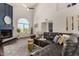 Inviting living area with a fireplace, large windows, and comfortable, stylish furniture at 6520 E Sugarloaf St, Mesa, AZ 85215