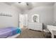 Bedroom featuring carpet floors, a ceiling fan, and a white dresser with a vanity at 69 E Benrich Dr, Gilbert, AZ 85295