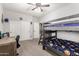 Bedroom featuring bunkbeds, carpet flooring, ceiling fan, closet, and plenty of space at 69 E Benrich Dr, Gilbert, AZ 85295