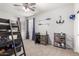 Bedroom with a ladder to the top bunk and a desk with decorations at 69 E Benrich Dr, Gilbert, AZ 85295