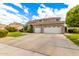 Inviting two-story home featuring a two-car garage and neutral color palette at 69 E Benrich Dr, Gilbert, AZ 85295