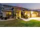 Charming stucco home with manicured lawn, dark trim, and desert landscaping at 69 E Benrich Dr, Gilbert, AZ 85295