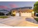 Inviting two-story home featuring a two-car garage and neutral color palette at 69 E Benrich Dr, Gilbert, AZ 85295