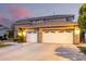Inviting two-story home featuring a two-car garage and neutral color palette at 69 E Benrich Dr, Gilbert, AZ 85295