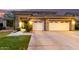 Charming stucco home with manicured lawn, dark trim, and desert landscaping at 69 E Benrich Dr, Gilbert, AZ 85295