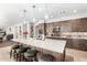 Spacious kitchen featuring a large island, stainless steel appliances, and eat in bar at 69 E Benrich Dr, Gilbert, AZ 85295