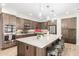 Modern kitchen featuring stainless steel appliances, a large island, and stylish pendant lighting at 69 E Benrich Dr, Gilbert, AZ 85295