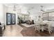 Bright living room with modern chandelier, decorative ceiling, and a stylish dining area at 69 E Benrich Dr, Gilbert, AZ 85295
