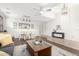 Spacious living area with a neutral color palette, tile flooring, and modern ceiling fan at 69 E Benrich Dr, Gilbert, AZ 85295