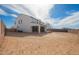 Large backyard with ample space, awaiting landscaping and personalization at 6980 W Hedge Hog Pl, Peoria, AZ 85383