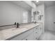 Elegant bathroom featuring dual sinks, granite counters, and modern fixtures, offering a luxurious experience at 6980 W Hedge Hog Pl, Peoria, AZ 85383