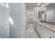 Bathroom showcasing dual sinks, sleek countertops, and modern finishes, creating a serene atmosphere at 6980 W Hedge Hog Pl, Peoria, AZ 85383