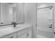 Clean, white bathroom showcasing a vanity, shower, and modern fixtures at 6980 W Hedge Hog Pl, Peoria, AZ 85383