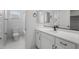 Modern bathroom with dual sinks, sleek fixtures, and stylish, neutral finishes at 6980 W Hedge Hog Pl, Peoria, AZ 85383