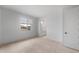 Light-filled bedroom with a window and attached bathroom for convenience at 6980 W Hedge Hog Pl, Peoria, AZ 85383