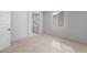 Neutral bedroom features carpeted floors and a light-filled adjoining bathroom at 6980 W Hedge Hog Pl, Peoria, AZ 85383