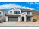 Charming two-story home with a tile roof, desert landscaping, and a two car garage at 6980 W Hedge Hog Pl, Peoria, AZ 85383