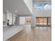 Bright, open-concept living room with wood floors and sliding doors leading to outdoor space at 6980 W Hedge Hog Pl, Peoria, AZ 85383