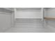Spacious walk-in closet with ample shelving and storage, providing organization and convenience at 6980 W Hedge Hog Pl, Peoria, AZ 85383
