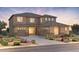 Stunning two-story home with a desert landscape and a three-car garage at 6982 W Plum Rd, Peoria, AZ 85383