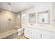 Modern bathroom featuring a dual sink vanity, large shower, and stylish finishes at 8201 E Piccadilly Rd, Scottsdale, AZ 85251